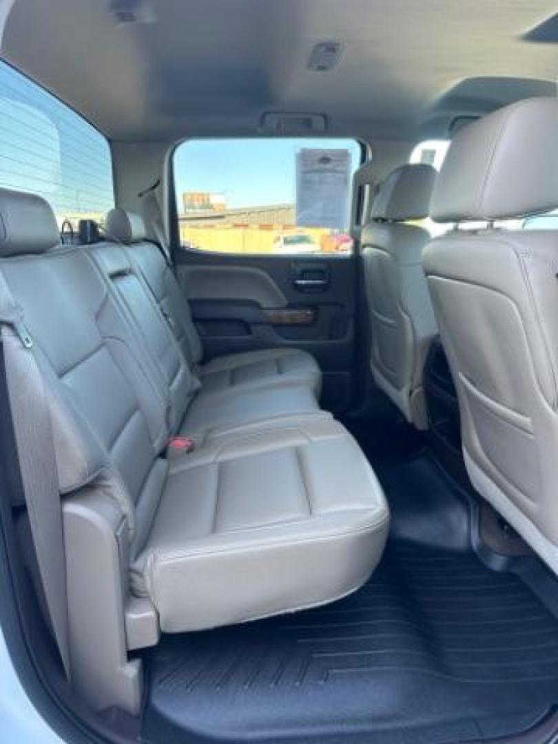 2015 Summit White /Cocoa/Dune, leather GMC Sierra 1500 SLT Crew Cab Short Box 4WD (3GTU2VEJ6FG) with an 6.2L V8 OHV 16V engine, 6-Speed Automatic transmission, located at 1235 N Woodruff Ave., Idaho Falls, 83401, (208) 523-1053, 43.507172, -112.000488 - Photo#32