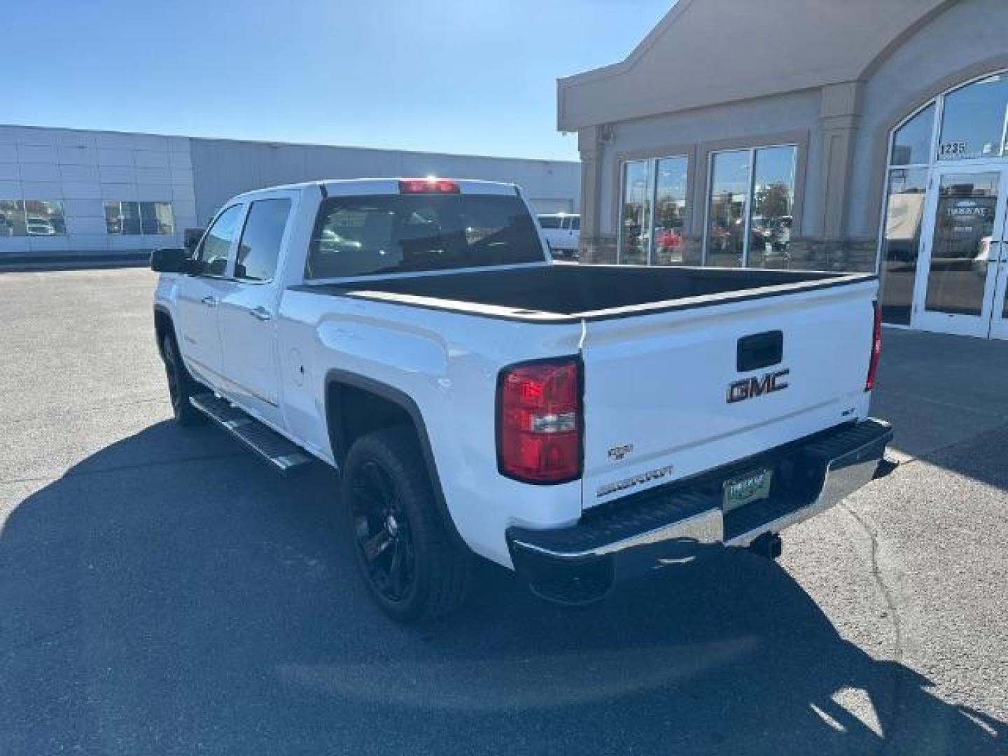 2015 Summit White /Cocoa/Dune, leather GMC Sierra 1500 SLT Crew Cab Short Box 4WD (3GTU2VEJ6FG) with an 6.2L V8 OHV 16V engine, 6-Speed Automatic transmission, located at 1235 N Woodruff Ave., Idaho Falls, 83401, (208) 523-1053, 43.507172, -112.000488 - Photo#3