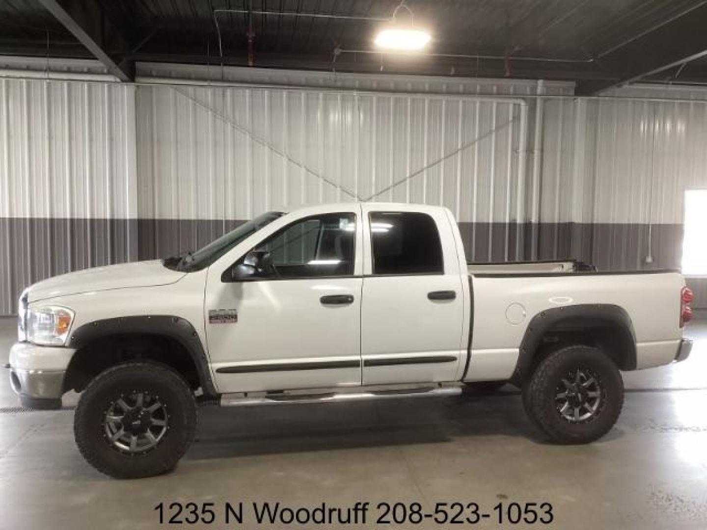 2007 Bright White /Medium Slate Gray Cloth Interior Dodge Ram 2500 SLT Quad Cab 4WD (1D7KS28A57J) with an 6.7L L6 OHV 24V TURBO DIESEL engine, 5-Speed Automatic transmission, located at 1235 N Woodruff Ave., Idaho Falls, 83401, (208) 523-1053, 43.507172, -112.000488 - Photo#1