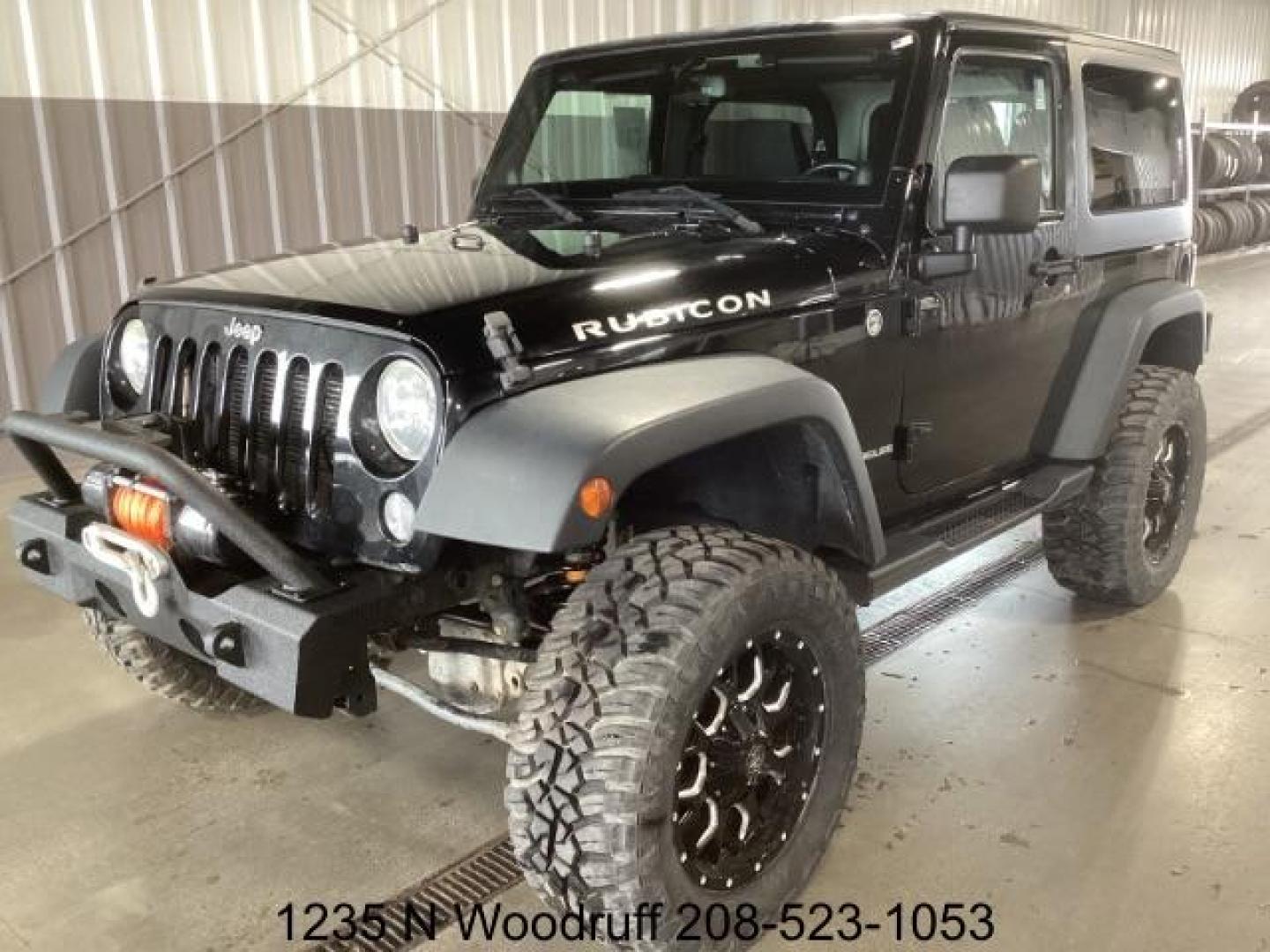 2014 Black Clearcoat /Black Jeep Wrangler Rubicon 4WD (1C4BJWCG6EL) with an 3.6L V6 DOHC 24V FFV engine, 5-Speed Automatic transmission, located at 1235 N Woodruff Ave., Idaho Falls, 83401, (208) 523-1053, 43.507172, -112.000488 - Photo#0