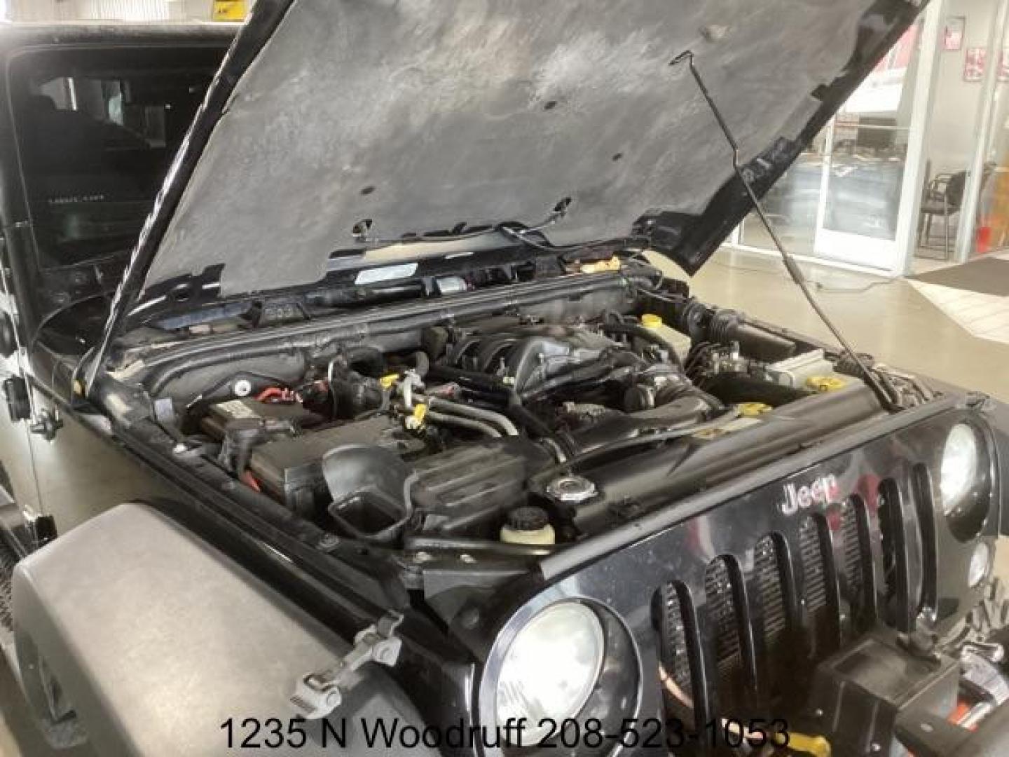 2014 Black Clearcoat /Black Jeep Wrangler Rubicon 4WD (1C4BJWCG6EL) with an 3.6L V6 DOHC 24V FFV engine, 5-Speed Automatic transmission, located at 1235 N Woodruff Ave., Idaho Falls, 83401, (208) 523-1053, 43.507172, -112.000488 - Photo#11