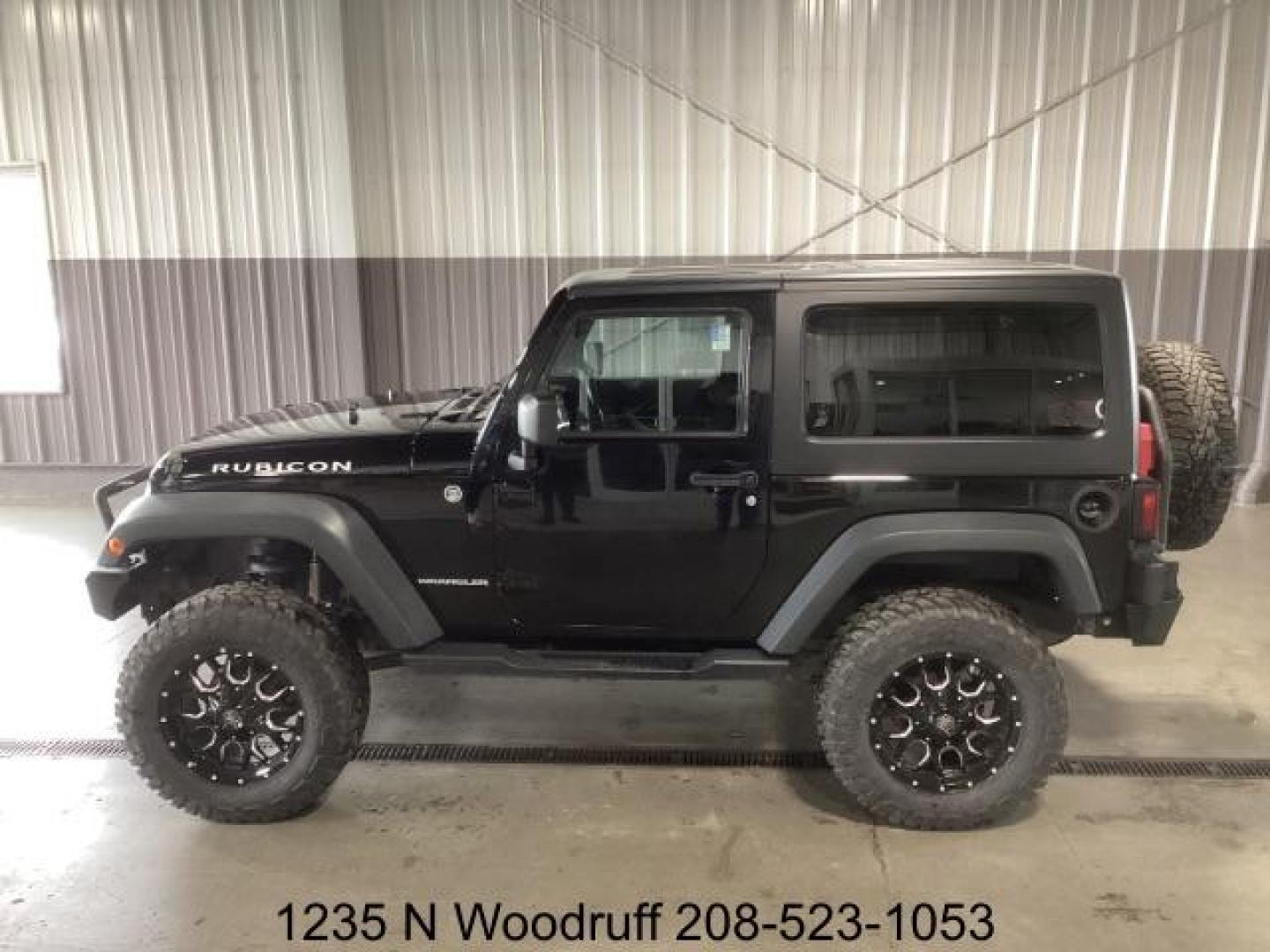 2014 Black Clearcoat /Black Jeep Wrangler Rubicon 4WD (1C4BJWCG6EL) with an 3.6L V6 DOHC 24V FFV engine, 5-Speed Automatic transmission, located at 1235 N Woodruff Ave., Idaho Falls, 83401, (208) 523-1053, 43.507172, -112.000488 - Photo#1