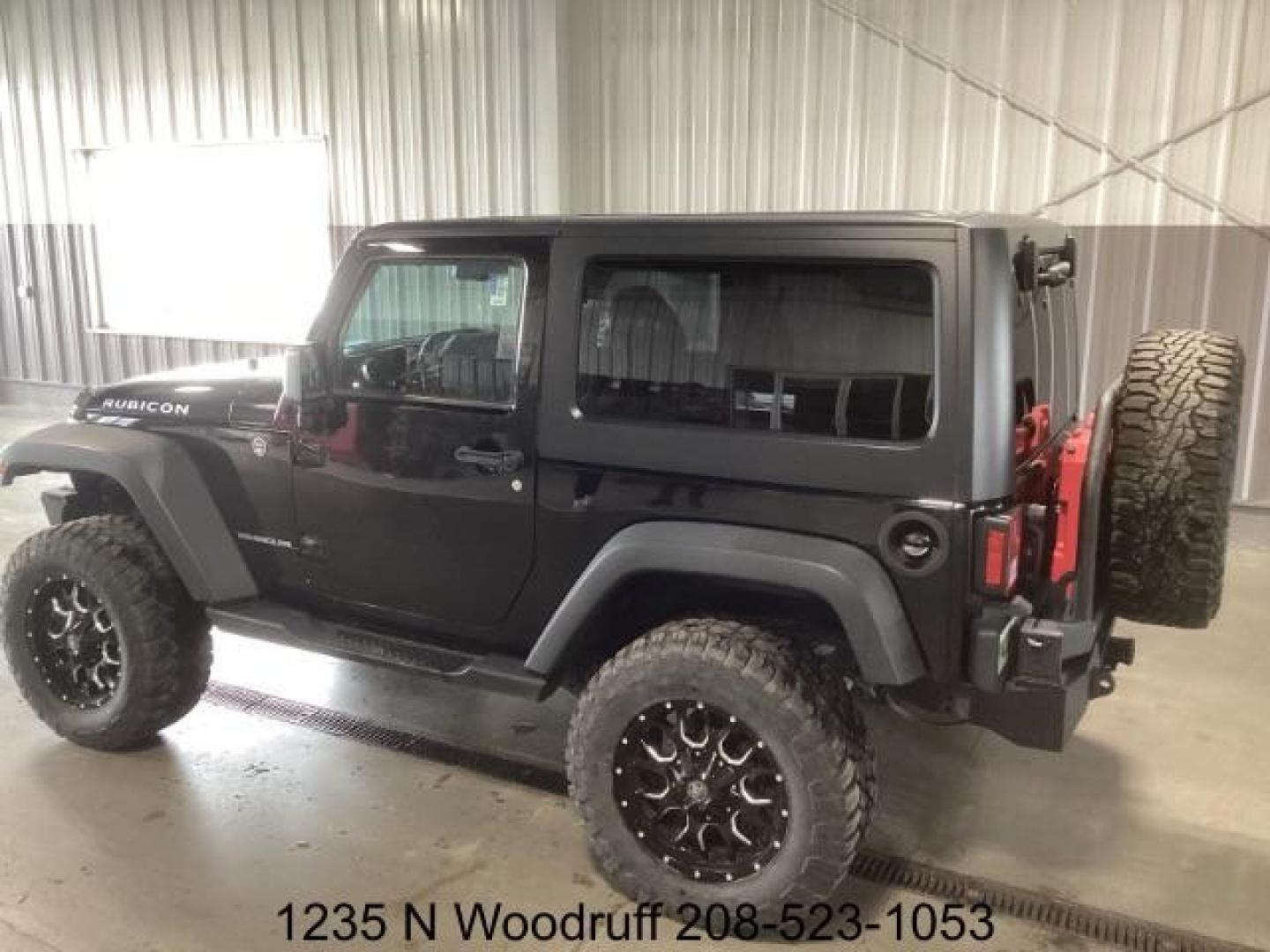 2014 Black Clearcoat /Black Jeep Wrangler Rubicon 4WD (1C4BJWCG6EL) with an 3.6L V6 DOHC 24V FFV engine, 5-Speed Automatic transmission, located at 1235 N Woodruff Ave., Idaho Falls, 83401, (208) 523-1053, 43.507172, -112.000488 - Photo#2