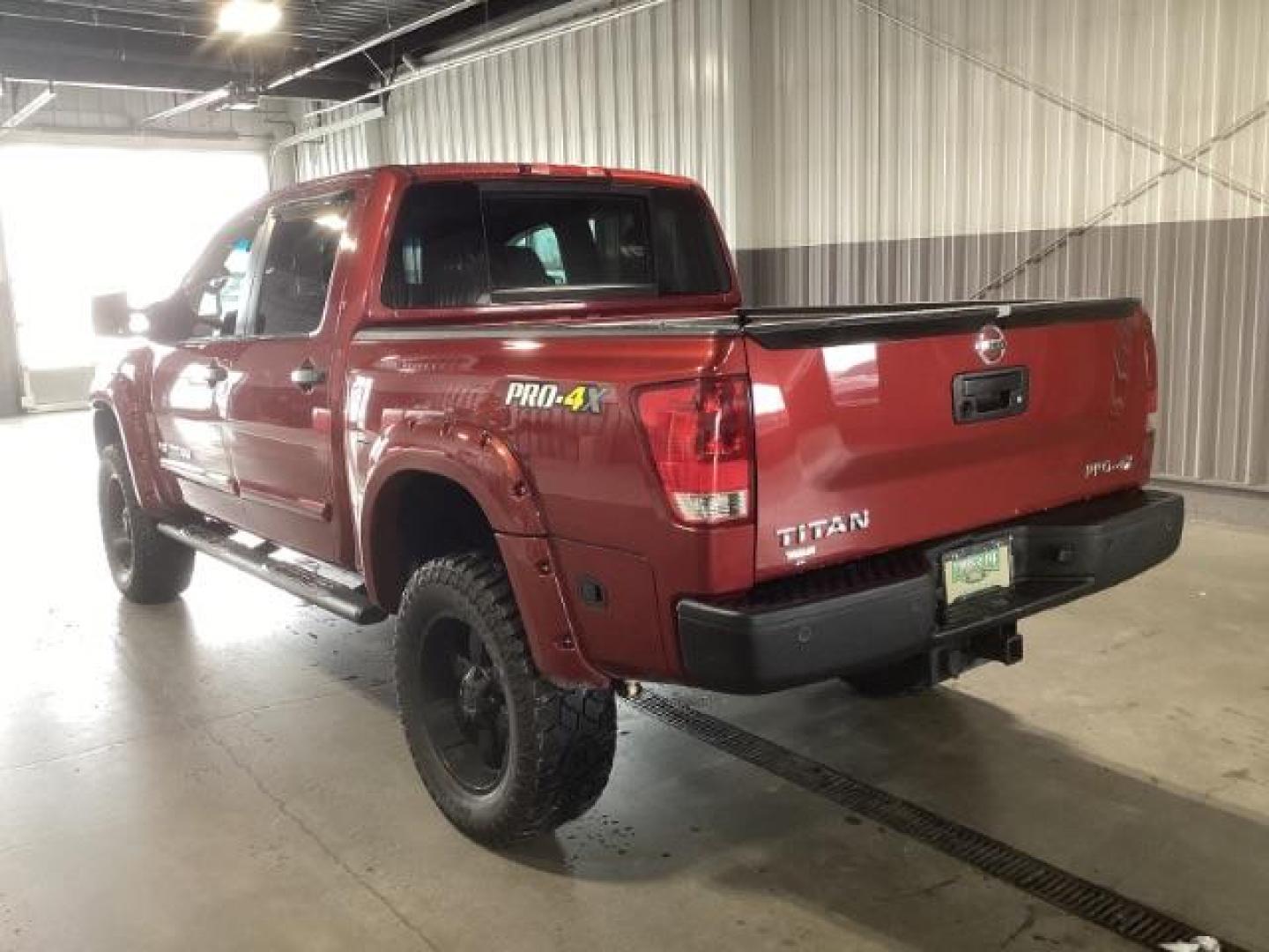 2014 Venetian Ruby /Charcoal II Nissan Titan PRO-4X Crew Cab 4WD SWB (1N6AA0ECXEN) with an 5.6L V8 DOHC 32V engine, 5-Speed Automatic transmission, located at 1235 N Woodruff Ave., Idaho Falls, 83401, (208) 523-1053, 43.507172, -112.000488 - Photo#2