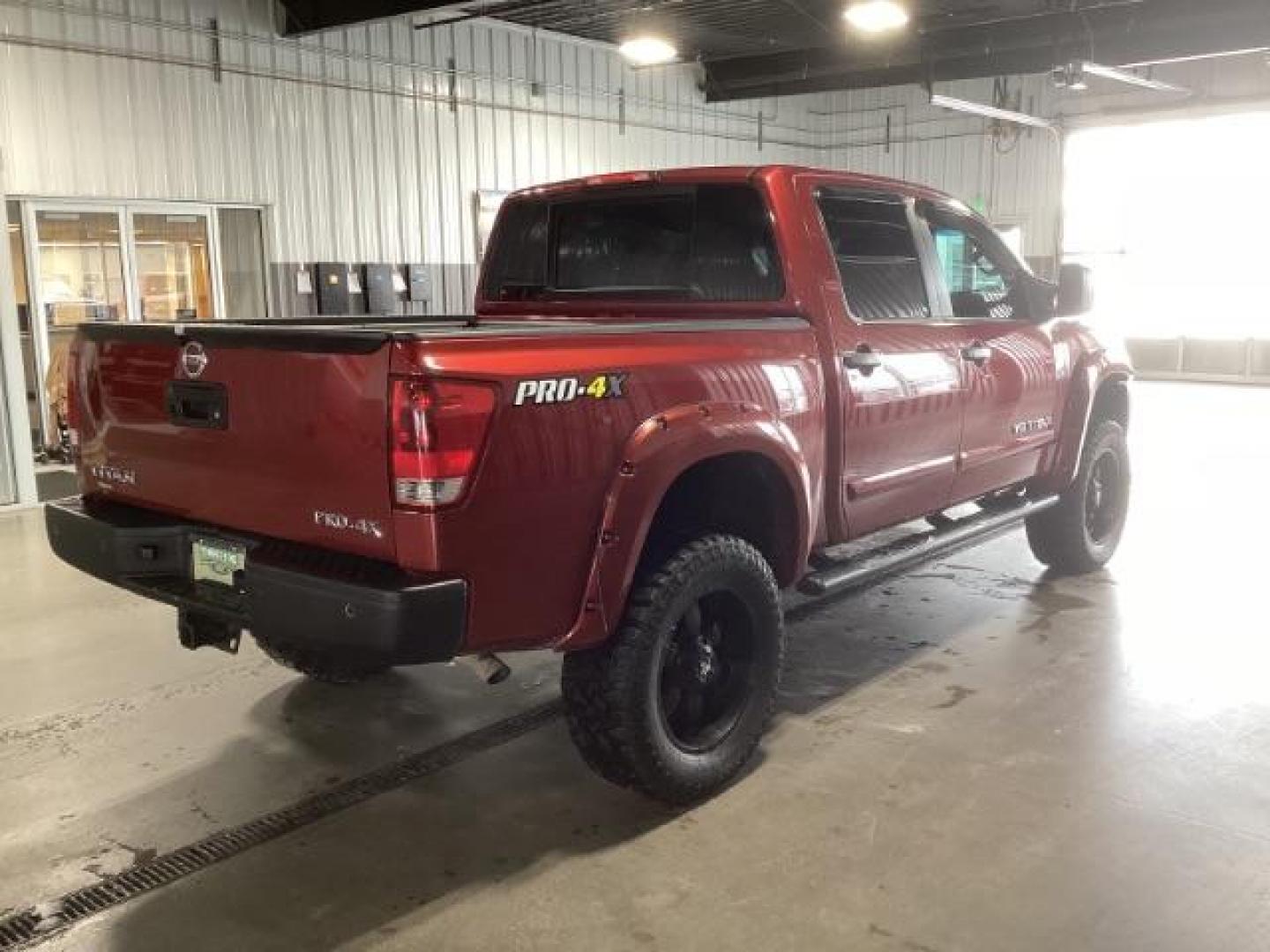 2014 Venetian Ruby /Charcoal II Nissan Titan PRO-4X Crew Cab 4WD SWB (1N6AA0ECXEN) with an 5.6L V8 DOHC 32V engine, 5-Speed Automatic transmission, located at 1235 N Woodruff Ave., Idaho Falls, 83401, (208) 523-1053, 43.507172, -112.000488 - Photo#4