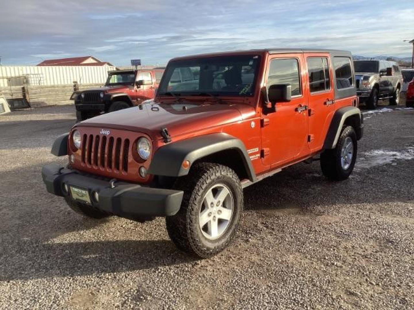 2014 Copperhead Pearlcoat Jeep Wrangler Unlimited Sport 4WD (1C4BJWDG7EL) with an 3.6L V6 DOHC 24V FFV engine, located at 1235 N Woodruff Ave., Idaho Falls, 83401, (208) 523-1053, 43.507172, -112.000488 - Photo#0