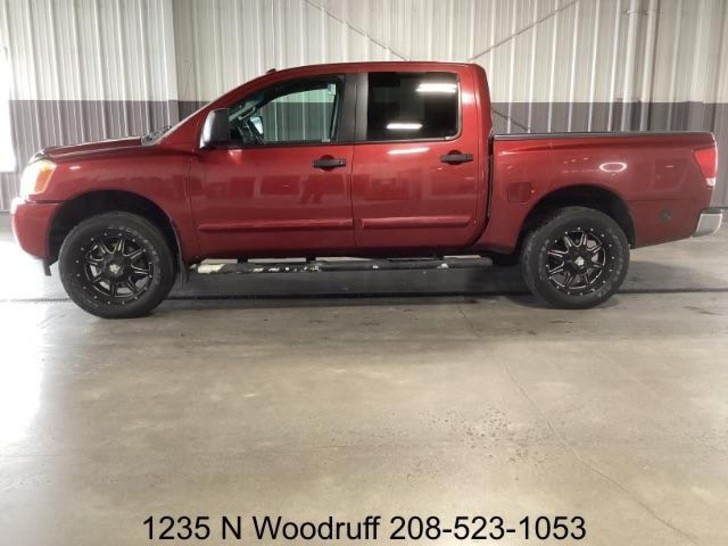 2014 Cayenne Red Metallic /Charcoal Nissan Titan SL Crew Cab 4WD (1N6AA0EC1EN) with an 5.6L V8 DOHC 32V engine, 5-Speed Automatic transmission, located at 1235 N Woodruff Ave., Idaho Falls, 83401, (208) 523-1053, 43.507172, -112.000488 - Photo#1