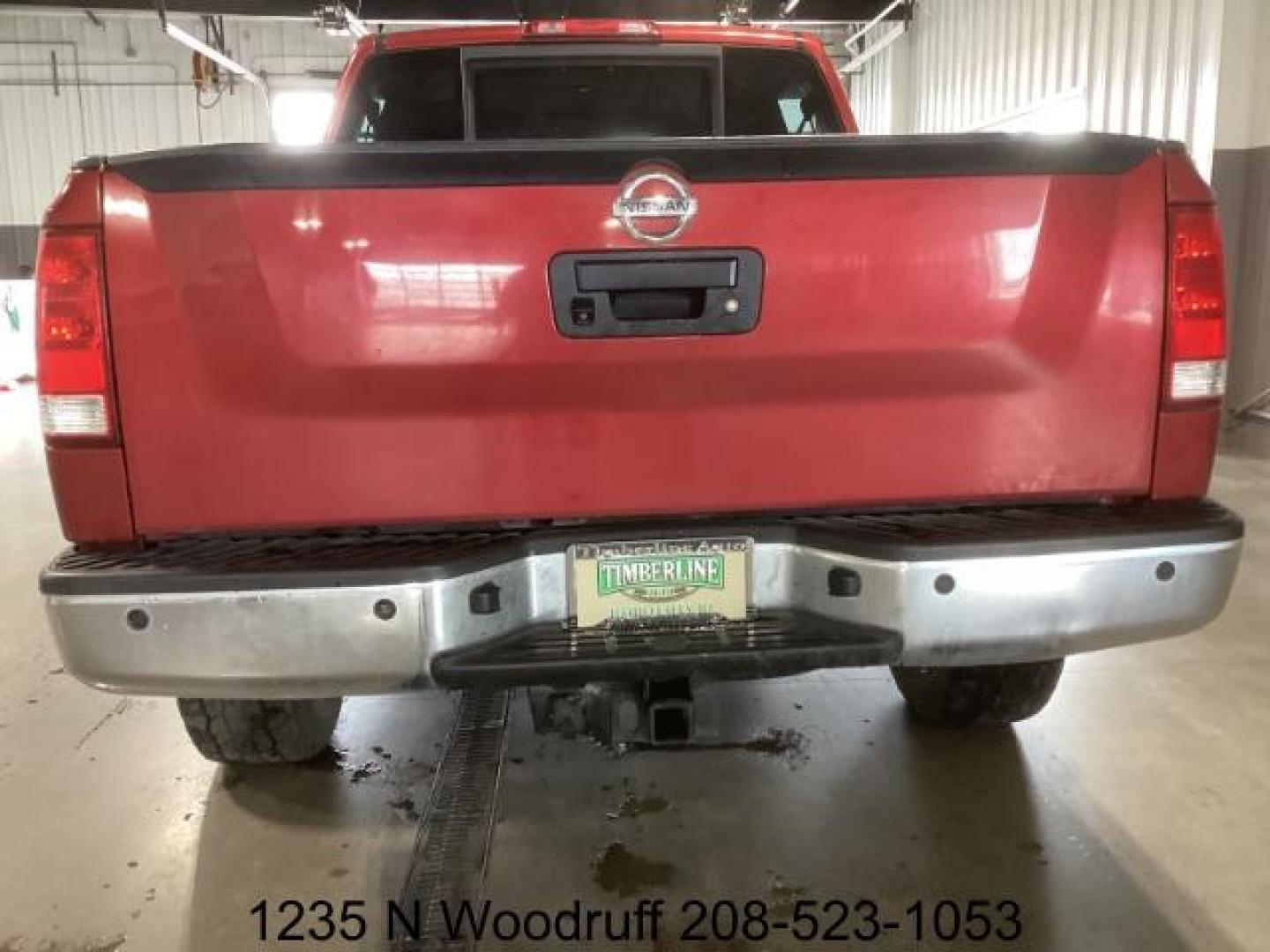 2014 Cayenne Red Metallic /Charcoal Nissan Titan SL Crew Cab 4WD (1N6AA0EC1EN) with an 5.6L V8 DOHC 32V engine, 5-Speed Automatic transmission, located at 1235 N Woodruff Ave., Idaho Falls, 83401, (208) 523-1053, 43.507172, -112.000488 - Photo#3