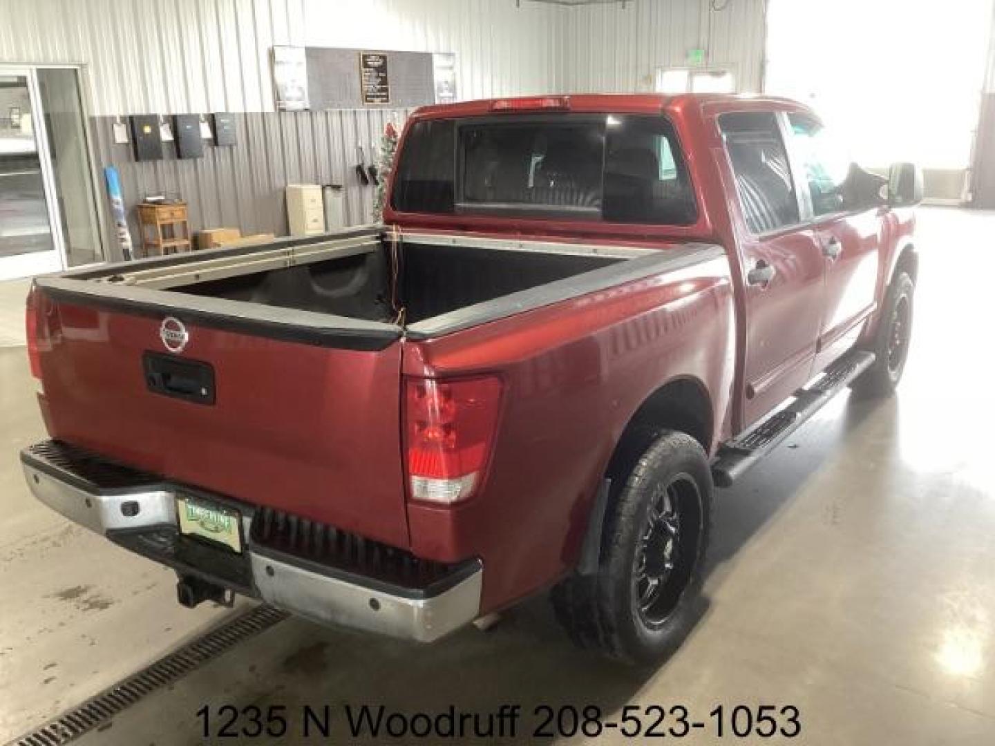 2014 Cayenne Red Metallic /Charcoal Nissan Titan SL Crew Cab 4WD (1N6AA0EC1EN) with an 5.6L V8 DOHC 32V engine, 5-Speed Automatic transmission, located at 1235 N Woodruff Ave., Idaho Falls, 83401, (208) 523-1053, 43.507172, -112.000488 - Photo#4