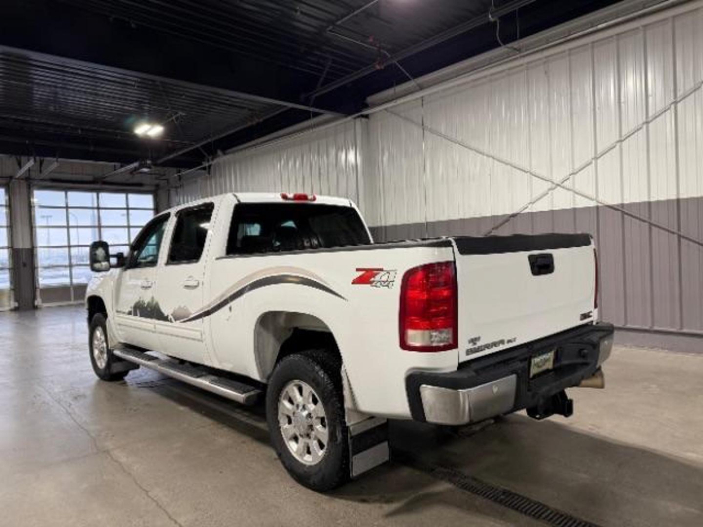 2012 Summit White /Ebony Leather Interior GMC Sierra 2500HD SLT Crew Cab 4WD (1GT121E8XCF) with an 6.6L V8 OHV 32V TURBO DIESEL engine, 6-Speed Automatic transmission, located at 1235 N Woodruff Ave., Idaho Falls, 83401, (208) 523-1053, 43.507172, -112.000488 - Photo#2