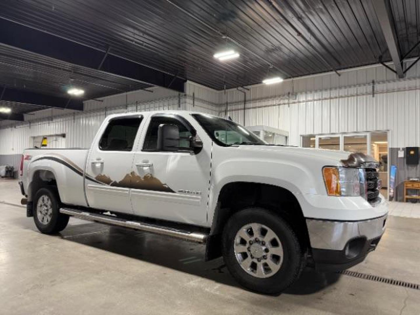 2012 Summit White /Ebony Leather Interior GMC Sierra 2500HD SLT Crew Cab 4WD (1GT121E8XCF) with an 6.6L V8 OHV 32V TURBO DIESEL engine, 6-Speed Automatic transmission, located at 1235 N Woodruff Ave., Idaho Falls, 83401, (208) 523-1053, 43.507172, -112.000488 - Photo#5