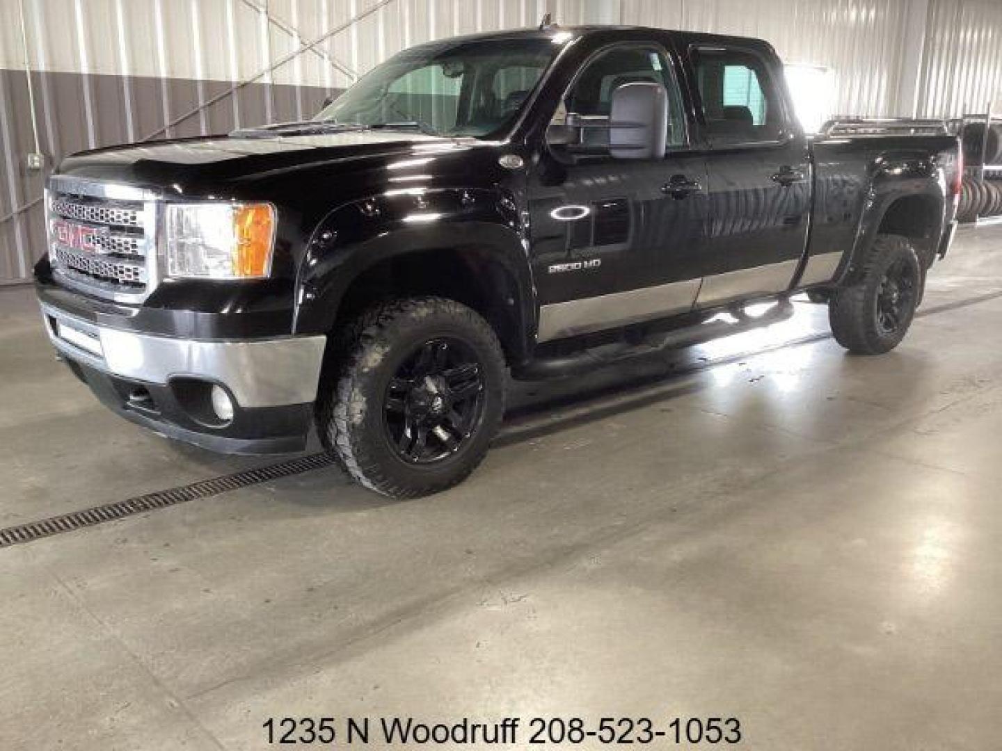 2013 Onyx Black /Ebony Leather Interior GMC Sierra 2500HD SLT Crew Cab 4WD (1GT121E86DF) with an 6.6L V8 OHV 32V TURBO DIESEL engine, 6-Speed Automatic transmission, located at 1235 N Woodruff Ave., Idaho Falls, 83401, (208) 523-1053, 43.507172, -112.000488 - Photo#0