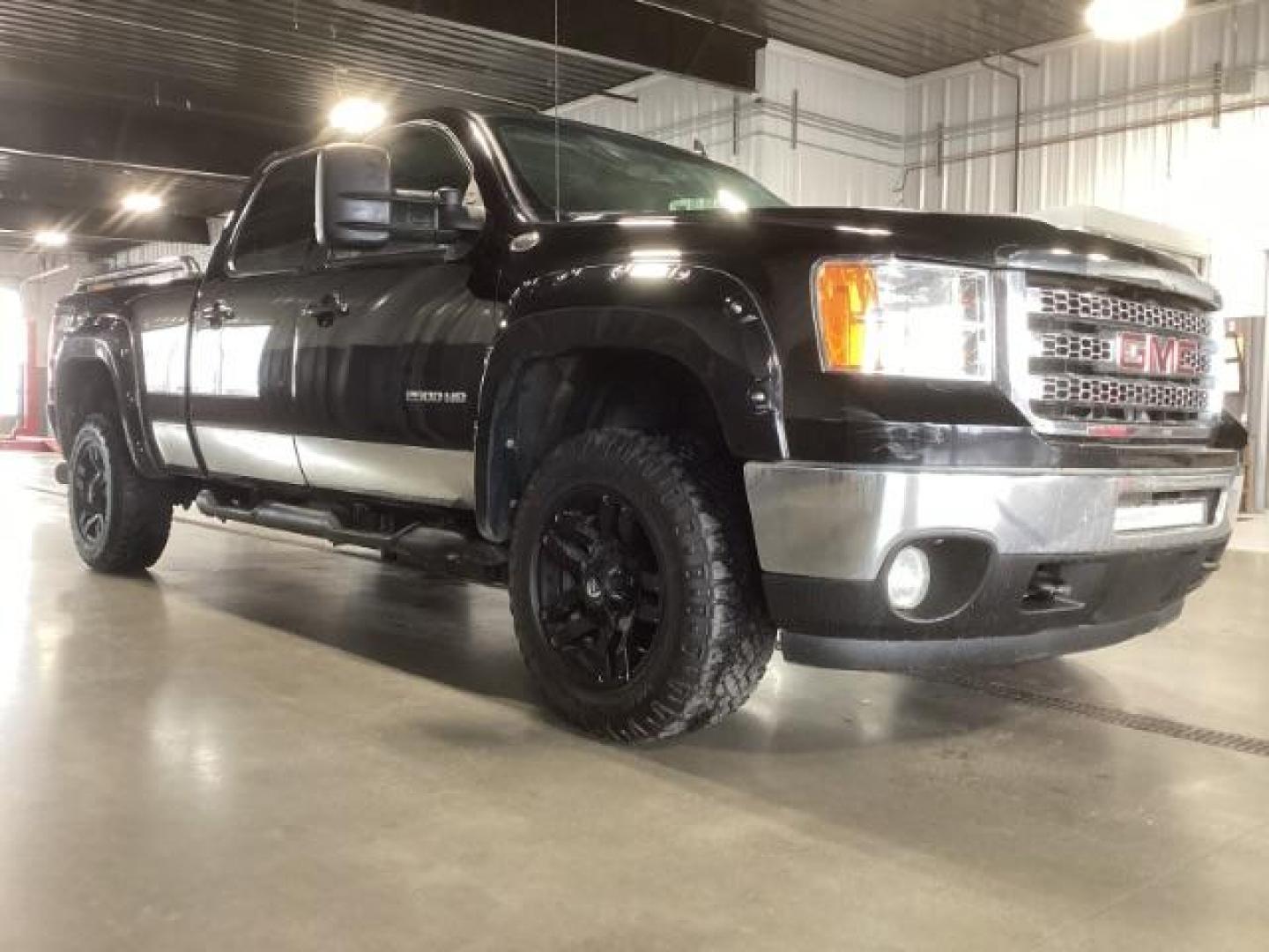 2013 Onyx Black /Ebony Leather Interior GMC Sierra 2500HD SLT Crew Cab 4WD (1GT121E86DF) with an 6.6L V8 OHV 32V TURBO DIESEL engine, 6-Speed Automatic transmission, located at 1235 N Woodruff Ave., Idaho Falls, 83401, (208) 523-1053, 43.507172, -112.000488 - Photo#5