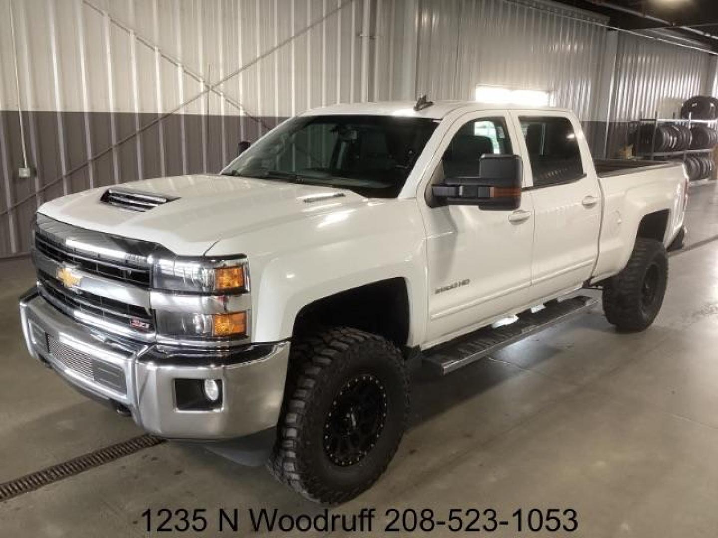 2019 Summit White /Jet Black, cloth Chevrolet Silverado 2500HD LT Crew Cab Short Box 4WD (1GC1KSEY5KF) with an 6.6L V8 OHV 16V DIESEL engine, 6-Speed Automatic transmission, located at 1235 N Woodruff Ave., Idaho Falls, 83401, (208) 523-1053, 43.507172, -112.000488 - Photo#0