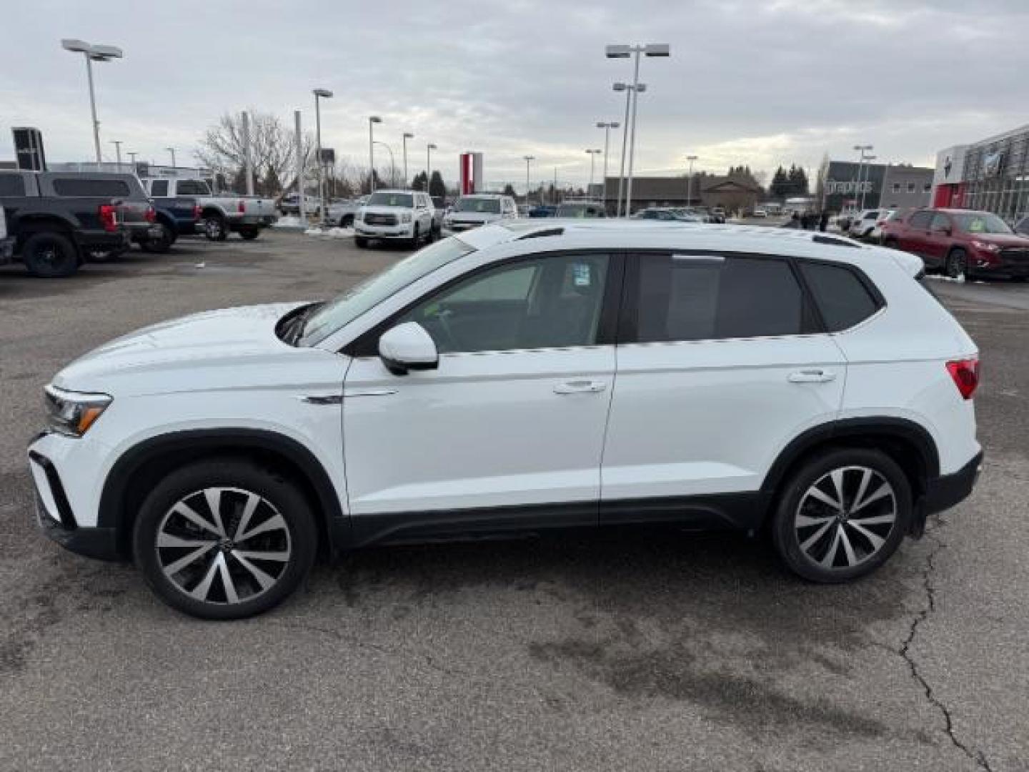 2023 Pure White /Black Volkswagen Taos SE 4Motion (3VVNX7B27PM) with an 1.5L L4 SFI DOHC 16V engine, 7-Speed Automatic transmission, located at 1235 N Woodruff Ave., Idaho Falls, 83401, (208) 523-1053, 43.507172, -112.000488 - Photo#0